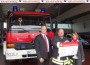 Feuerwehr im Einsatz: Sparkassen-Spendenscheck in Abwesenheit